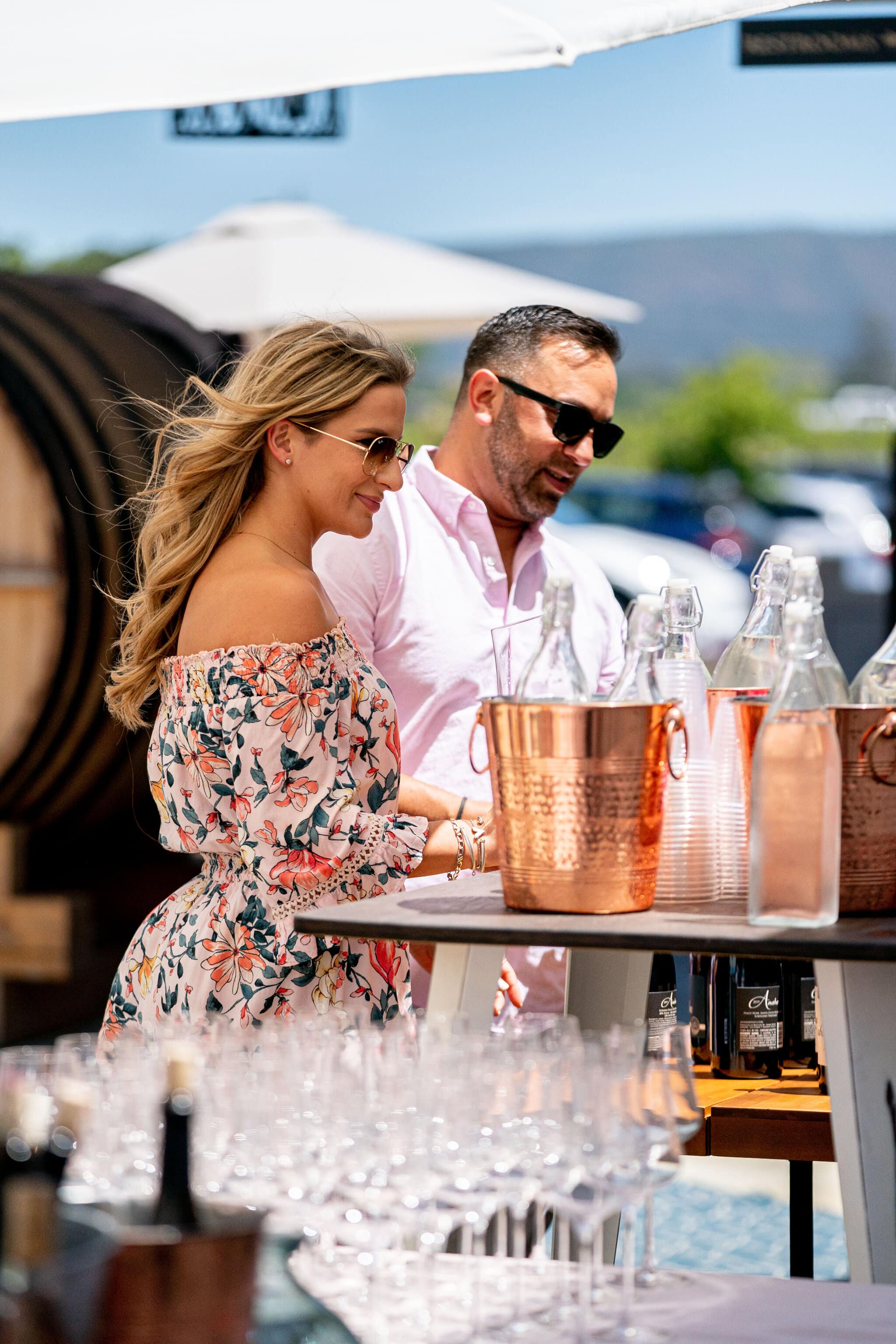 Couple sampling pink wine